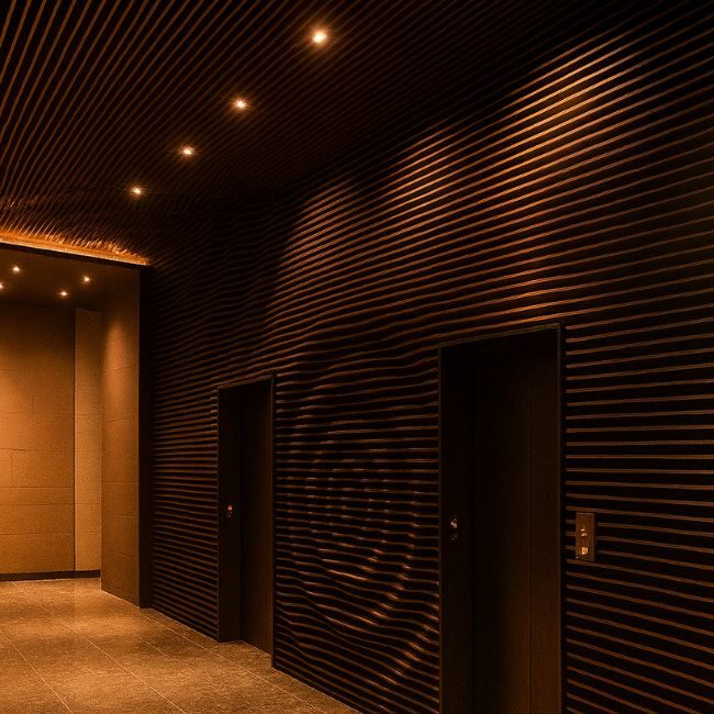 Modern interior with parametric dark wood wall and ceiling featuring ripple patterns and integrated lighting, designed by Fomra for commercial spaces.